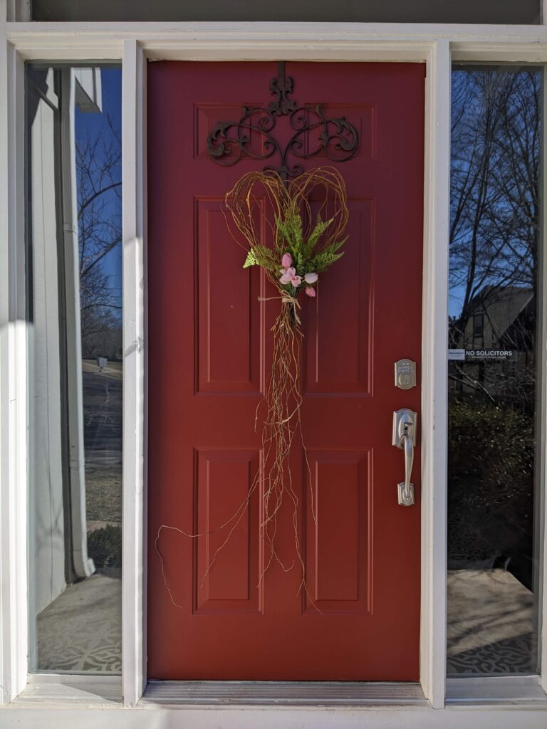 Finished curly willow heart shaped wreath hanging on my front door.